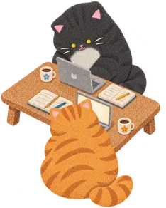 Two cats studying at a table for two